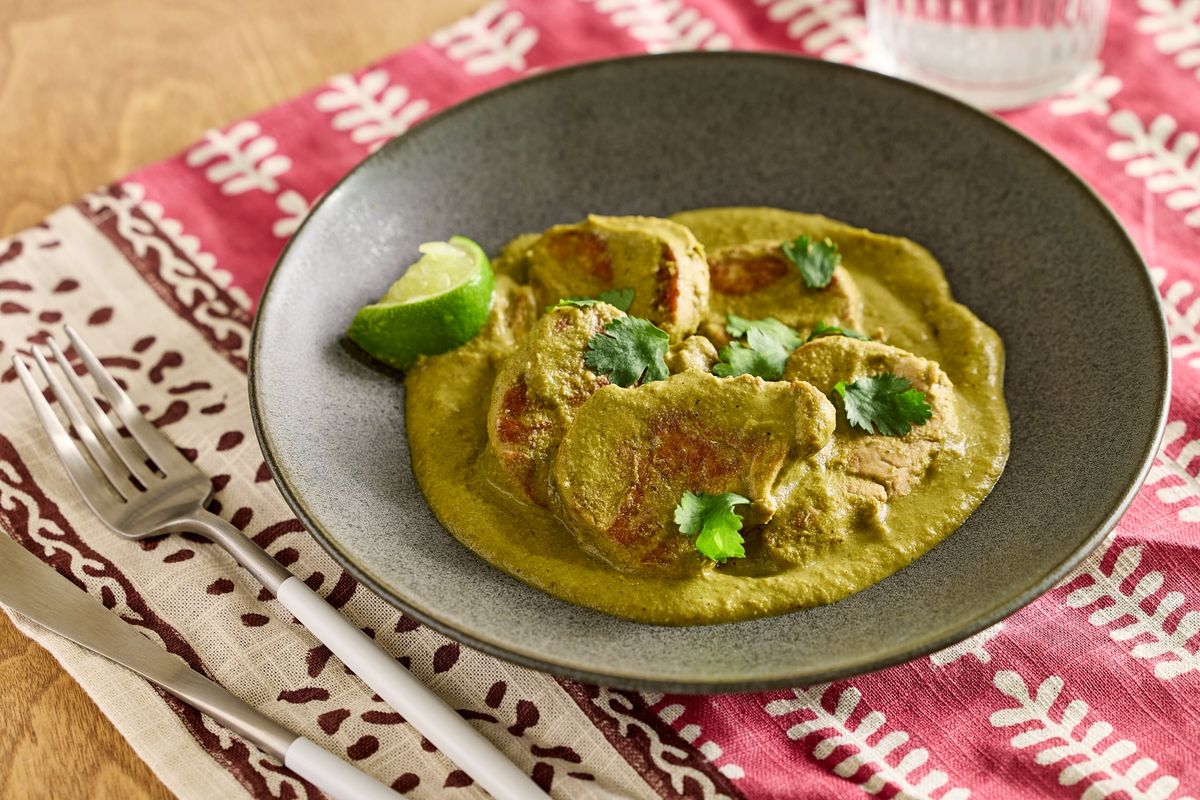 Pork tenderloin isn’t the star of this dish. Taking the stage instead is the Green Pipián Simmer Sauce, perfect for any protein and packed with vegetables.  (food styling by Gina Nistico/Both for the Washington Post)