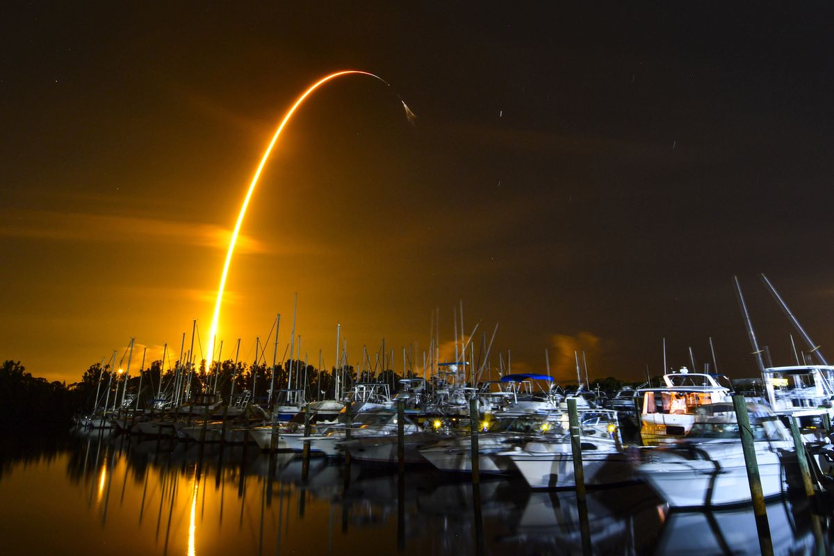 This long exposure photo shows the launch of a SpaceX Falcon 9 rocket on a resupply mission for NASA to the International Space Station from Pad 39A at Kennedy Space Center, seen from Merritt Island, Fla., on Sunday. The SpaceX shipment including ants, avocados and a human-sized robotic arm arrived at the International Space Station on Monday.  (Malcolm Denemark)