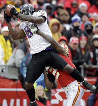 Ravens wide receiver Anquan Boldin hauls in a 4-yard TD pass in the third quarter Sunday. (Associated Press)