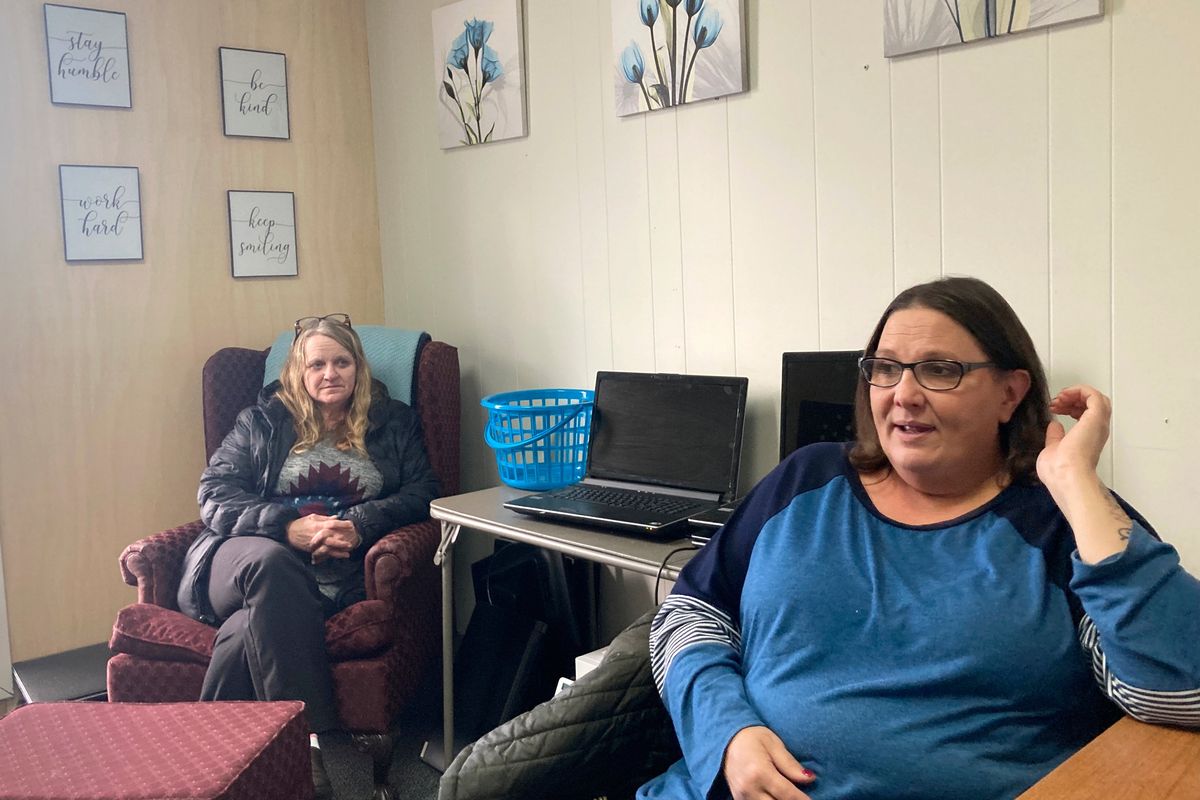 Anne Muilenburg, right, and Debra Cross speak during an interview Thursday, Dec. 9, 2021, in Muilenburg