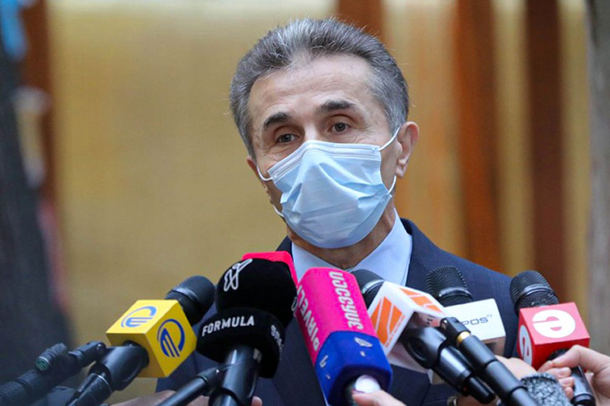 In this handout photo released by Georgian Dream Party Press office, Georgian businessman Bidzina Ivanishvili, who created Georgian Dream party, wearing a face mask to help curb the spread of the coronavirus, speaks to the media after voting at a polling station during the parliamentary elections in Tbilisi, Georgia, Saturday, Oct. 31, 2020. Ivanishvili quickly congratulated his supporters on winning the vote after several exit polls showed his party with a strong lead. (HOGP)