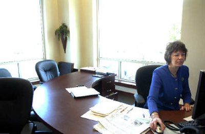 
Broker Shelley McDowell works in her office at Century 21 Beutler & Associates, a new agency, in Spokane on Monday morning. McDowell has temporarily stepped into the broker role that was to be filled by Gary Fox, who recently drowned. 
 (Holly Pickett / The Spokesman-Review)