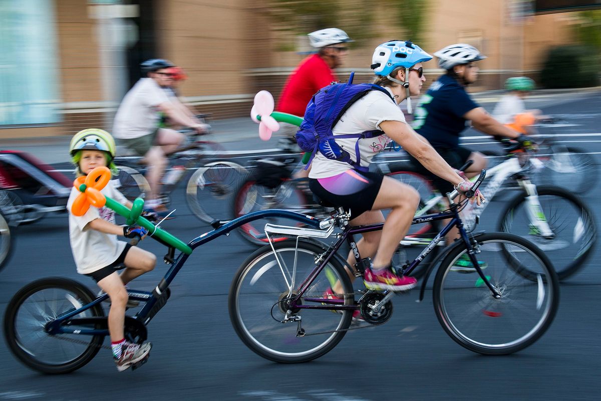 Bicyclists start their 9 or 21-mile ride along Spokane Falls Boulevard during SpokeFest on Sept. 13, 2015, in downtown Spokane. The Spokane City Council last year repealed its law requiring bicyclists to wear helmets.  (COLIN MULVANY/The Spokesman-Review)