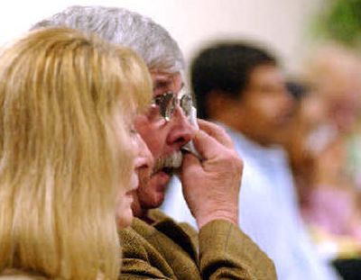 
Ginni and Tom Kuchman attend a memorial service in Olympia on Wednesday for Washington workers killed on the job. Their daughter, Kim Miles, died last year when she was struck by a falling object while working as a longshoreman in Pierce County. 
 (RICHARD ROESLER / The Spokesman-Review)