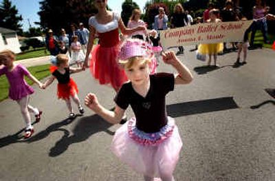 
Alyssa Hilsiker, 4, dances her way down the street while marching in the West Valley Days parade with her fellow dance students from Company Ballet School on Saturday morning. 
 (Amanda Smith / The Spokesman-Review)