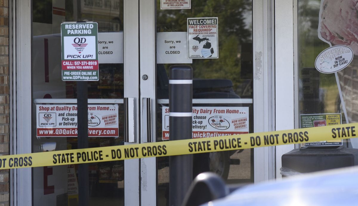 The scene where a 77-year-old man was stabbed by a 43-year-old man Tuesday morning, July 14, 2020, outside of a Quality Dairy on Lansing Road in Windsor Township, Michigan. A Grand Ledge man who stabbed an elderly man outside a Quality Dairy store after being refused service for not wearing a mask was shot and killed by an Eaton County deputy several miles away, Michigan State Police said.  (Matthew Dae Smith)