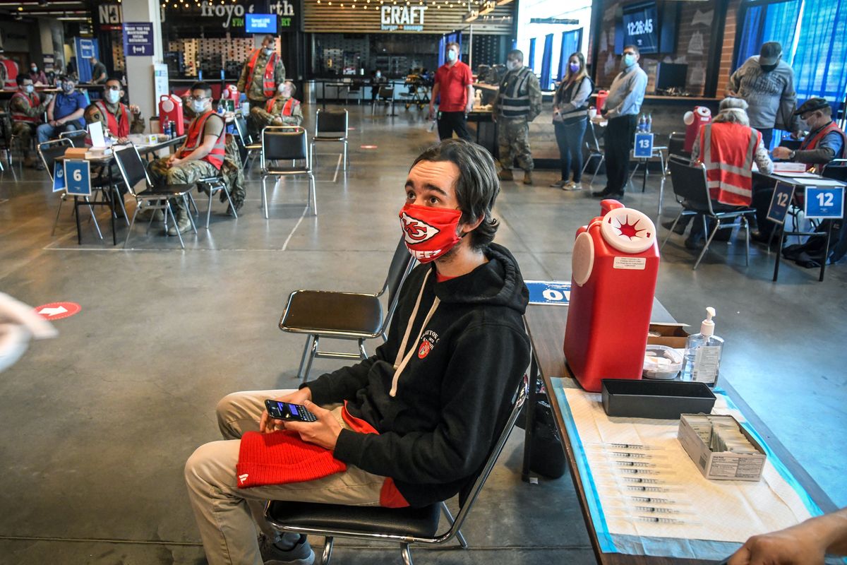 Cameron Cozort, 21, waits to gets his first Moderna vaccination on Friday, April 2, 2021, at the Spokane Arena. (Dan Pelle/The Spokesman-Review)