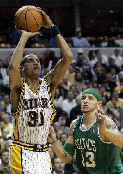 
Indiana's Reggie Miller hits a fourth-quarter bucket over the Celtics' Delonte West en route to 33 points.
 (Associated Press / The Spokesman-Review)