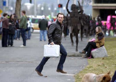 
Actor Christian Slater races through Riverfront Park while shooting a scene for the North by Northwest movie 
