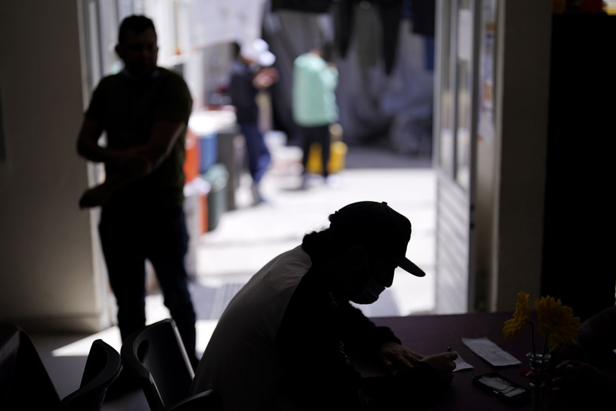 A man from Nicaragua sits at a shelter for migrants Thursday, April 21, 2022, in Tijuana, Mexico. The man is waiting in Mexico for hearings in U.S. immigration court, part of a Trump-era policy that will be argued Tuesday before the U.S. Supreme Court.  (Gregory Bull)