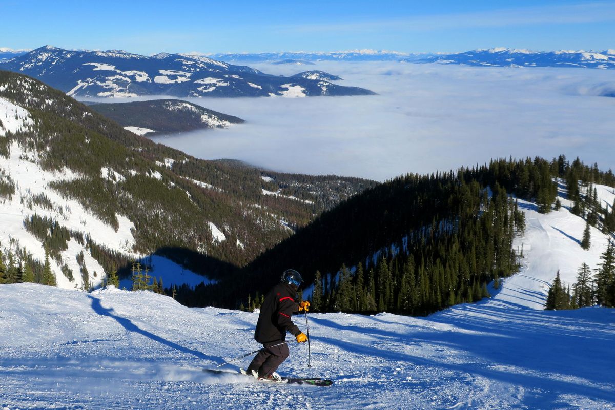 A skier turns above the clouds on Buffalo Ridge near the top of Granite Mountain at Red Mountain Resort. Photo by John Nelson (John  Nelson / The Spokesman-Review)