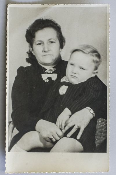 This photo provided by Paul Schmitz, a son of a United States World War II soldier, shows him as a little boy with his mother. (Associated Press)