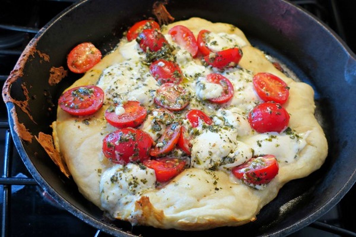 A cast iron skillet is the key to making awesome homemade pizza. (Leslie Kelly)
