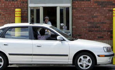 
Associated Press Compact cars may not be able to handle Americans' super-size lifestyle.
 (File Associated Press / The Spokesman-Review)