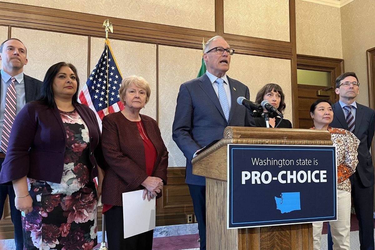 Gov. Jay Inslee, surrounded by, from left to right, Democratic lawmakers Marcus Riccelli, Manka Dhingra, Karen Keiser, Jessica Bateman and My-Linh Thai and Attorney General Bob Ferguson, announced the state purchase of 30,000 doses of the abortion drug mifepristone. Lawmakers introduced legislation to allow the Department of Corrections to distribute the drug to licensed health providers.  (Laurel Demkovich / The Spokesman-Review)