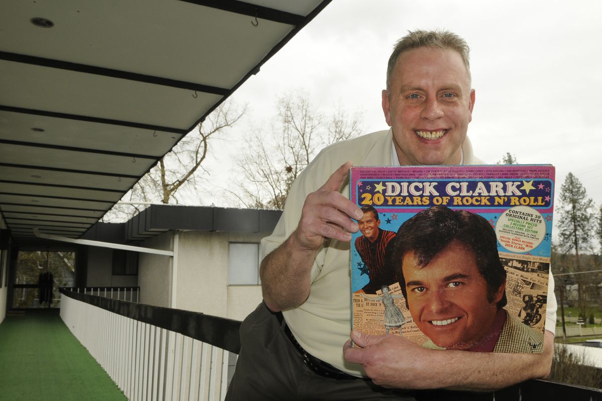 Mark Wilhelm, of Spokane, holds his autographed phonograph album signed by Dick Clark in 1977. Wilhelm said his favorite musical guests on the show were singer Blondie and disco queen Donna Summer. (Dan Pelle)