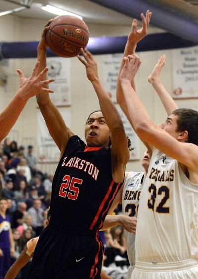 Clarkston's Trevon Allen splits Lewiston defenders as he drives to the hoop during early season action. The two-time Great Northern League MVP has led the defending champion Bantams back to the state 2A tournament. (Kyle Mills / Kyle Mills 
Lewiston Tribune)