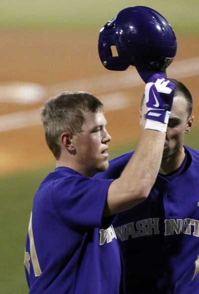 Andrew Ely hit two-run home run to spark Huskies (page B3). (Associated Press)