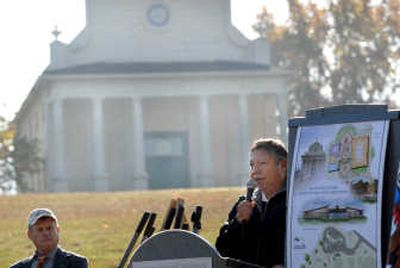 
With the Cataldo Mission behind him, Ernie Stensgar speaks Tuesday about  plans for the new visitors center and museum that the Coeur d'Alene Tribe is helping to build at Old Mission State Park. At left is retired park manager Bill Scudder. 
 (Jesse Tinsley / The Spokesman-Review)
