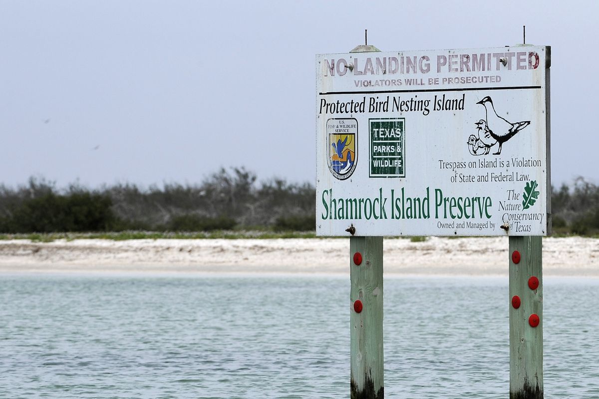 A sign warns trespassers off Shamrock Island, near Aransas Pass, Texas. (Associated Press)