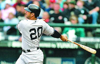 
New York's Jorge Posada starts a five-run second with an RBI single. 
 (Associated Press / The Spokesman-Review)