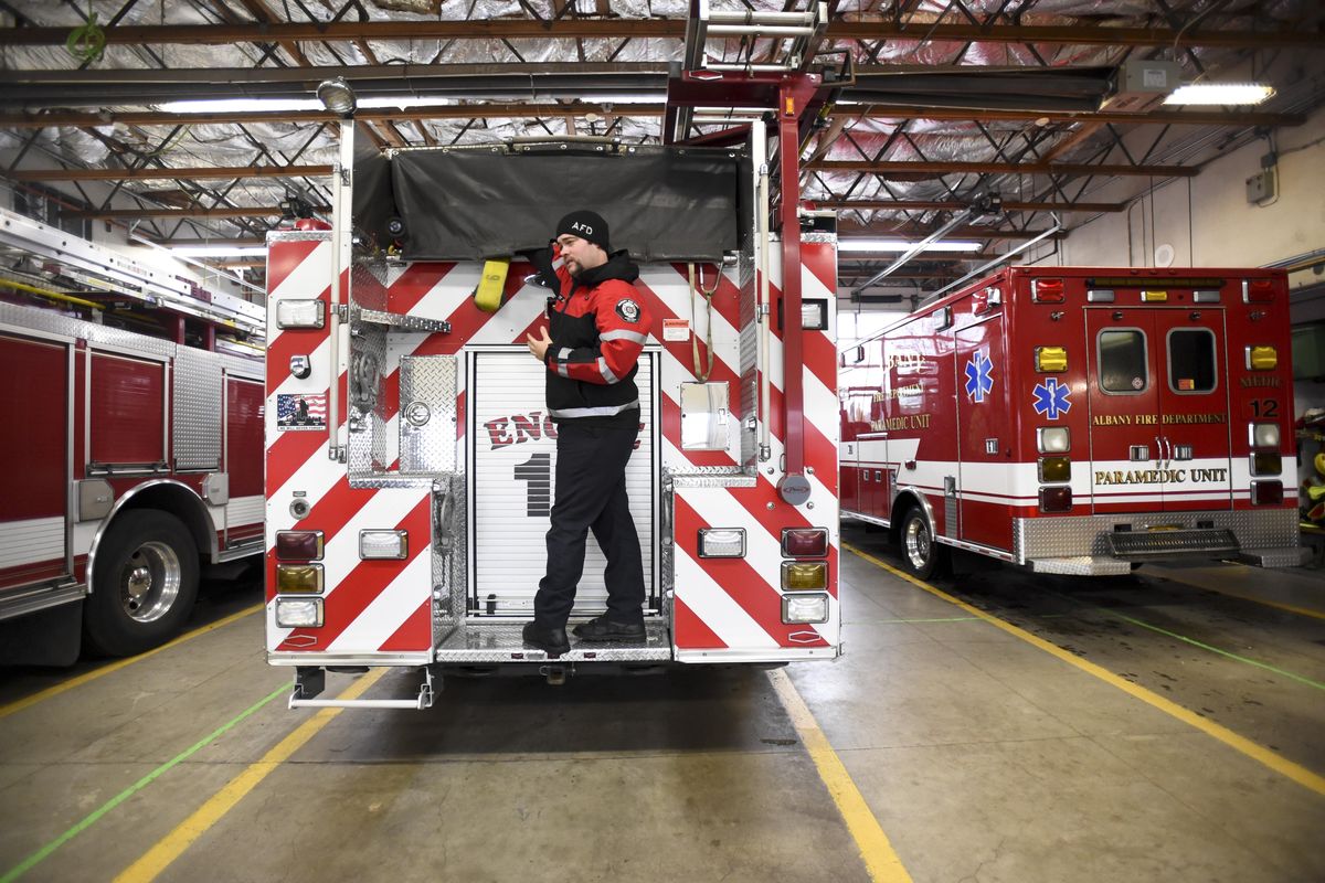 Paramedic Matt Johnson explains the equipment carried by an Albany Fire Department engine on Nov. 15. (Amanda Loman / Albany Democrat-Herald)