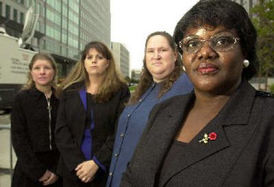 
 In a file photo Betty Dukes, right, lead plaintiff in a potential class-action suit against Wal-Mart, poses with fellow plaintiffs shortly From right to left are Dukes, Patricia Surgenson, Stephanie Odle and Christine Kwapnoski. Their suit alleged Wal-Mart discriminated against female employees. 
 (Associated Press / The Spokesman-Review)