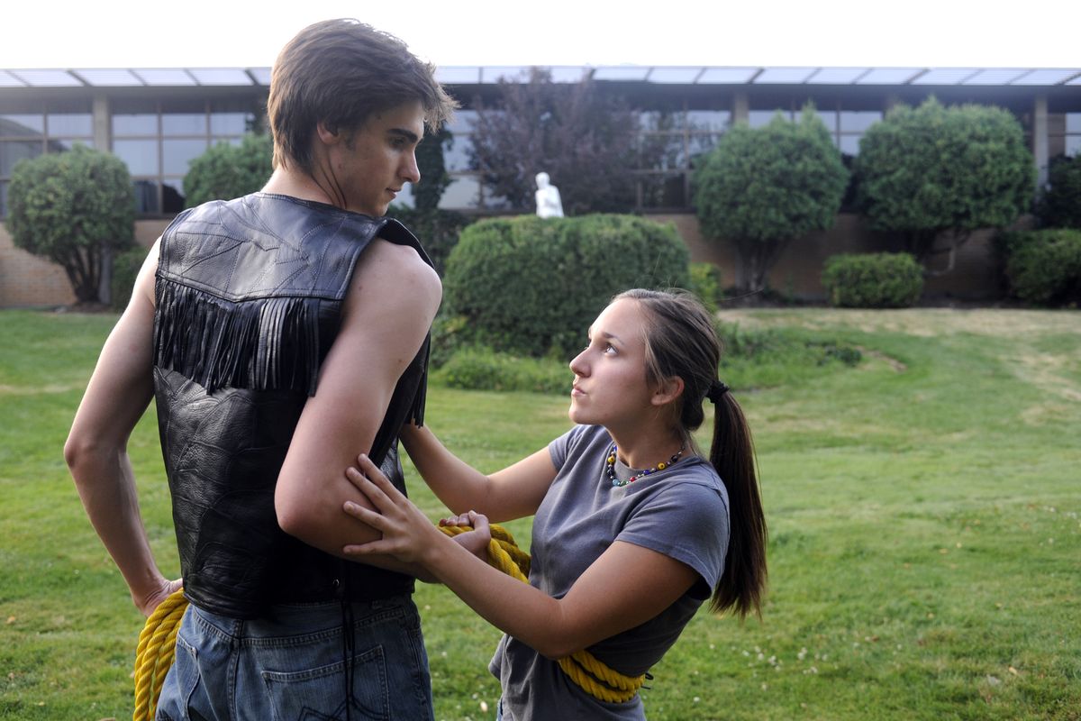 Petruchio, played by Michael Heye, and the feisty Katherine, played by Millie Duchow, tussle in rehearsal of “The Taming of the Shrew” July 29 at Gonzaga Prep. The outdoor production  opens Saturday. (Jesse Tinsley / The Spokesman-Review)