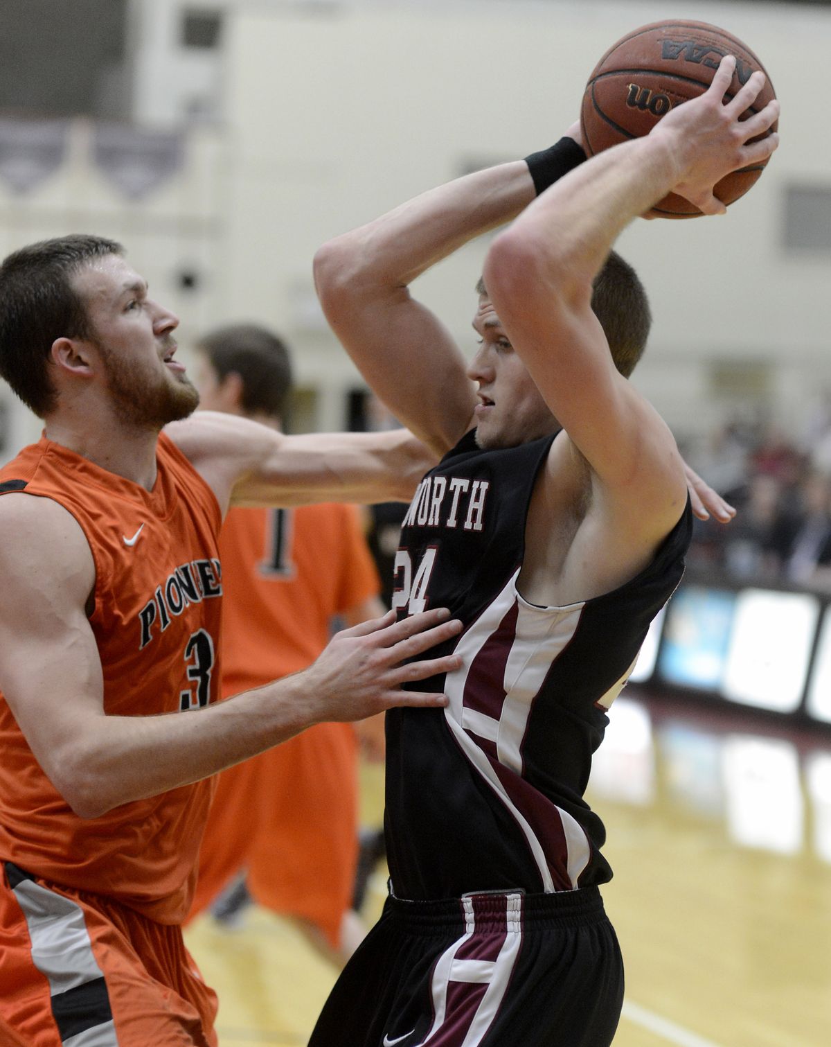 Pirate Taylor Farnsworth looks to pass against Ross Erickson. (Colin Mulvany)