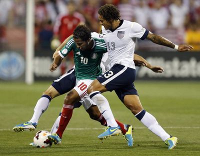 Jermaine Jones of the U.S., right, battles Giovani dos Santos of Mexico for possession.