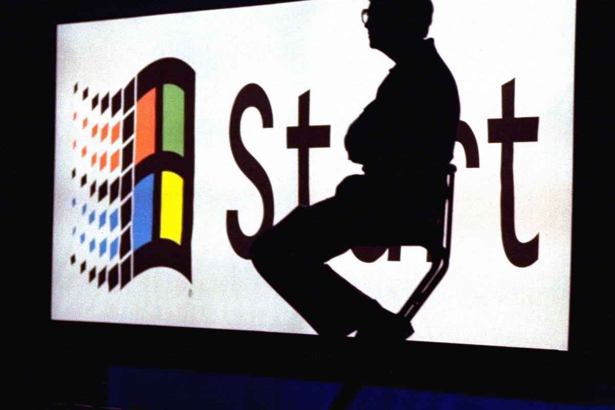 FILE - In this Aug. 24, 1995, file photo, Microsoft Chairman Bill Gates sits on stage during a video portion of the Windows 95 Launch Event  on the company