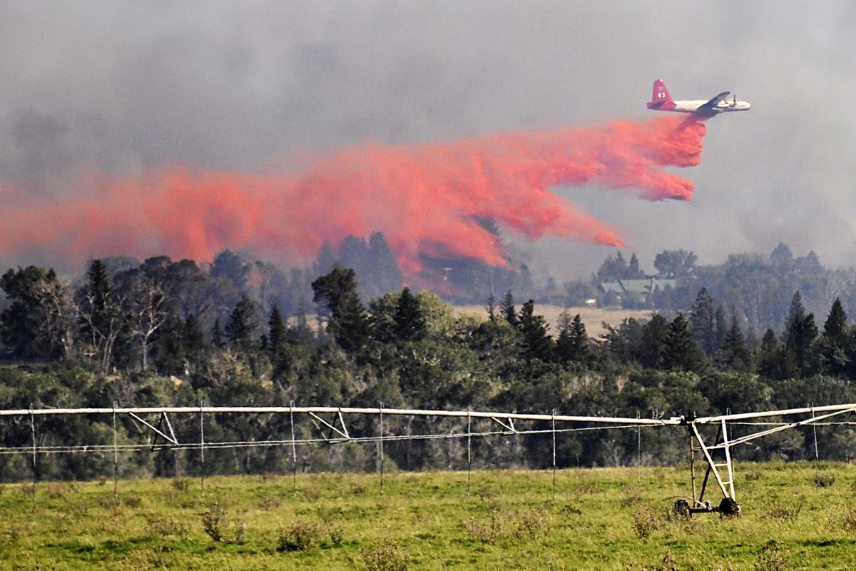 An air tanker drops retardant on the Pine Creek fire just south of the Yellowstone River, Wednesday, Aug. 29, 2012 in Livingston, Mont.. (Shawn Raecke / Livingston Enterprise)
