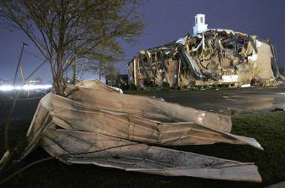 
Pieces of building material litter the area near a church in Tennessee on Friday, after a line of severe thunderstorms and tornadoes  pulverized homes and killed at least 11 people in the state. 
 (Associated Press / The Spokesman-Review)