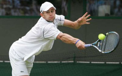 
American Andy Roddick reaches for a shot during his first-round Wimbledon singles win over  Janko Tipsarevic. 
 (Associated Press / The Spokesman-Review)