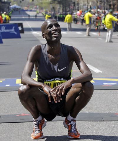 Wesley Korir of Kenya smiles after crossing the finish line to win the men's division of the 2012 Boston Marathon on Monday. (Associated Press)