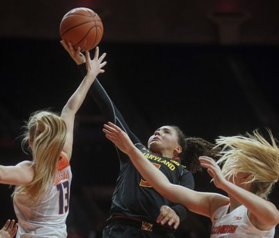 Maryland guard Destiny Slocum (5) tries to pull down a rebound against Illinois guard Peca Holesinska (13) and forward Ali Andrews (50) in the second half during an NCAA college basketball game in Champaign, Ill., on Thursday, Jan. 26, 2017. Maryland won 94-49. (Heather Coit / Associated Press)