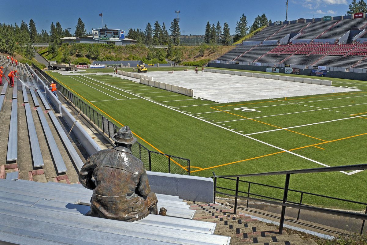 Crews ready Albi Stadium for Saturday’s Shock-Blaze outdoor game under the watchful eye of “Joe Fan,” a sculpture by Vincent De Felice. (Christopher Anderson)