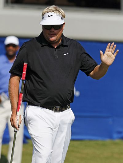 Carl Pettersson acknowledges the crowd at the 17th green Thursday as he closes in on an 8-under-par 62. (Associated Press)