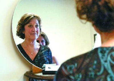 
Gustafson checks out her newly inked eyebrows. 
 (The Spokesman-Review)
