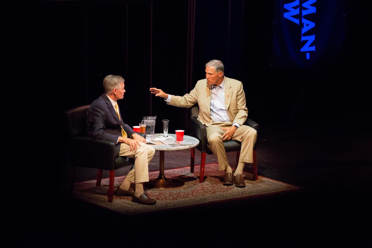 Spokesman-Review political reporter Jim Camden, left, interviews Washington Gov. Jay Inslee during the newspaper’s Pints and Politics event Monday, July 30, 2018, at the Spokane Civic Theatre. (Libby Kamrowski / The Spokesman-Review)