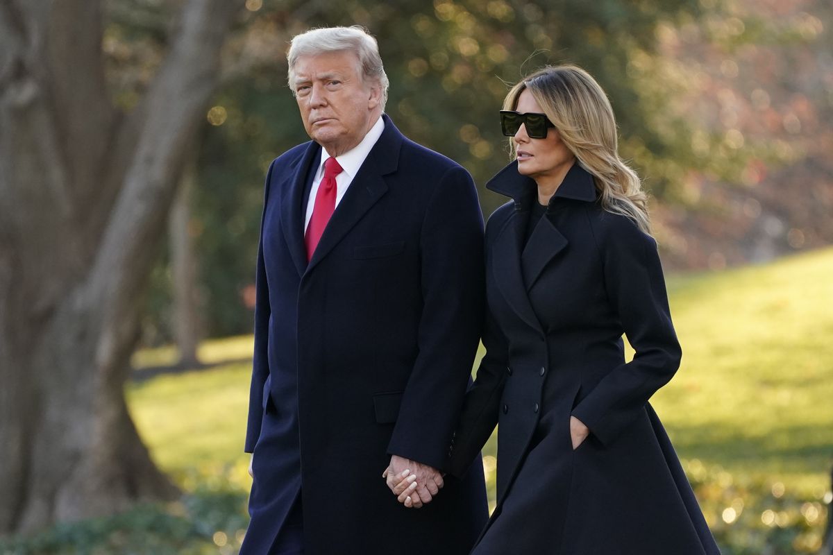 President Donald Trump and first lady Melania Trump walk to board Marine One on the South Lawn of the White House, Wednesday, Dec. 23, 2020, in Washington. (Evan Vucci)