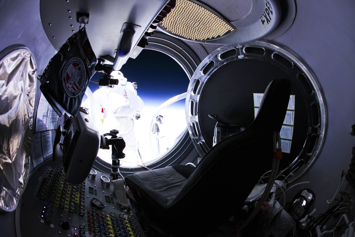 This photo provided by Red Bull Stratos shows pilot Felix Baumgartner of Austria as he jumps out of the capsule during the final manned flight for Red Bull Stratos on Sunday, Oct. 14, 2012. In a giant leap from more than 24 miles up, Baumgartner shattered the sound barrier Sunday while making the highest jump ever � a tumbling, death-defying plunge from a balloon to a safe landing in the New Mexico desert. (Jay Nemeth / Red Bull Stratos)