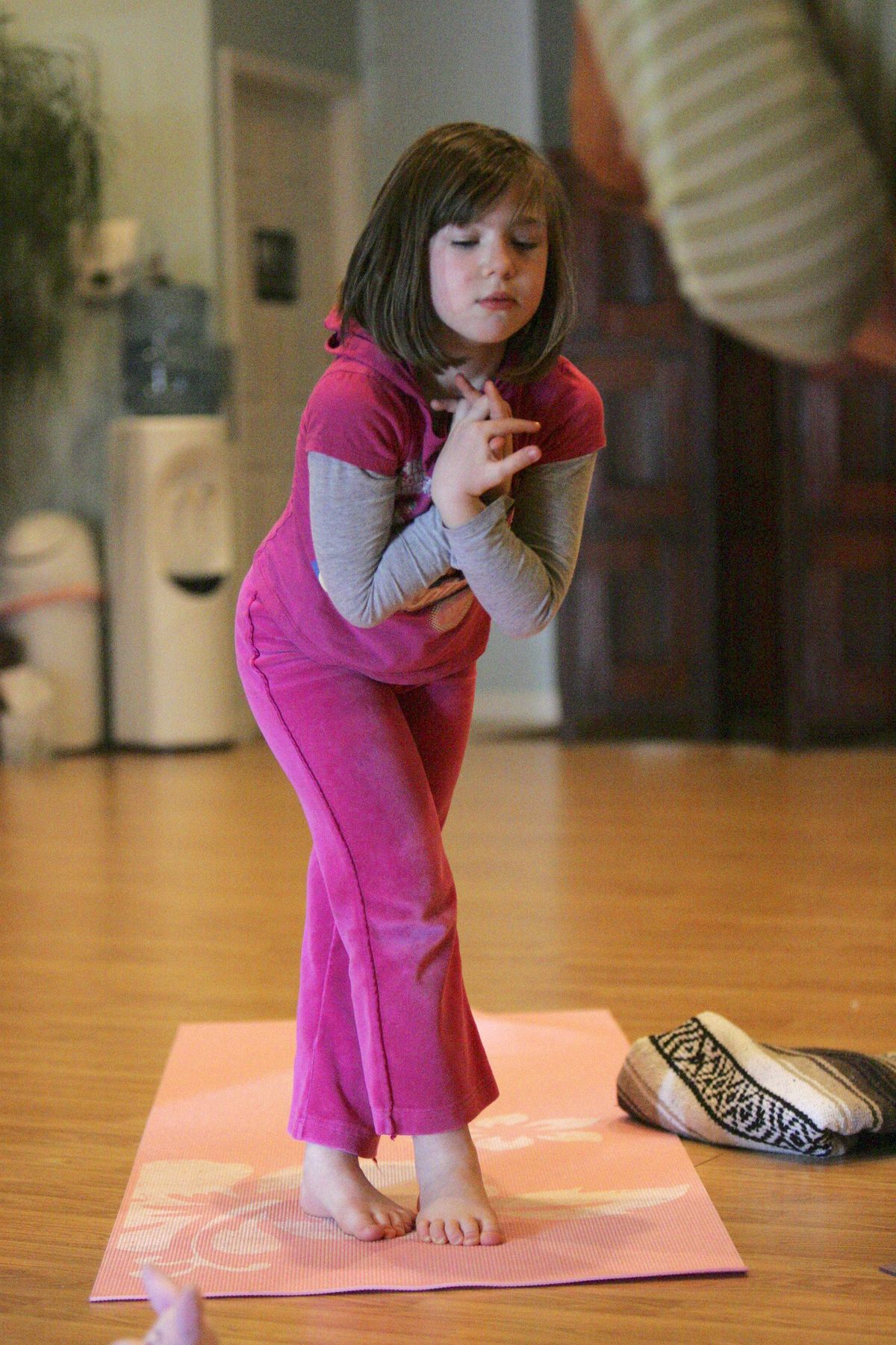 Olivia Kurek, 6, of Shelby Township, takes part in the Namaste Kids yoga class  April 8. (Patricia Beck / The Spokesman-Review)