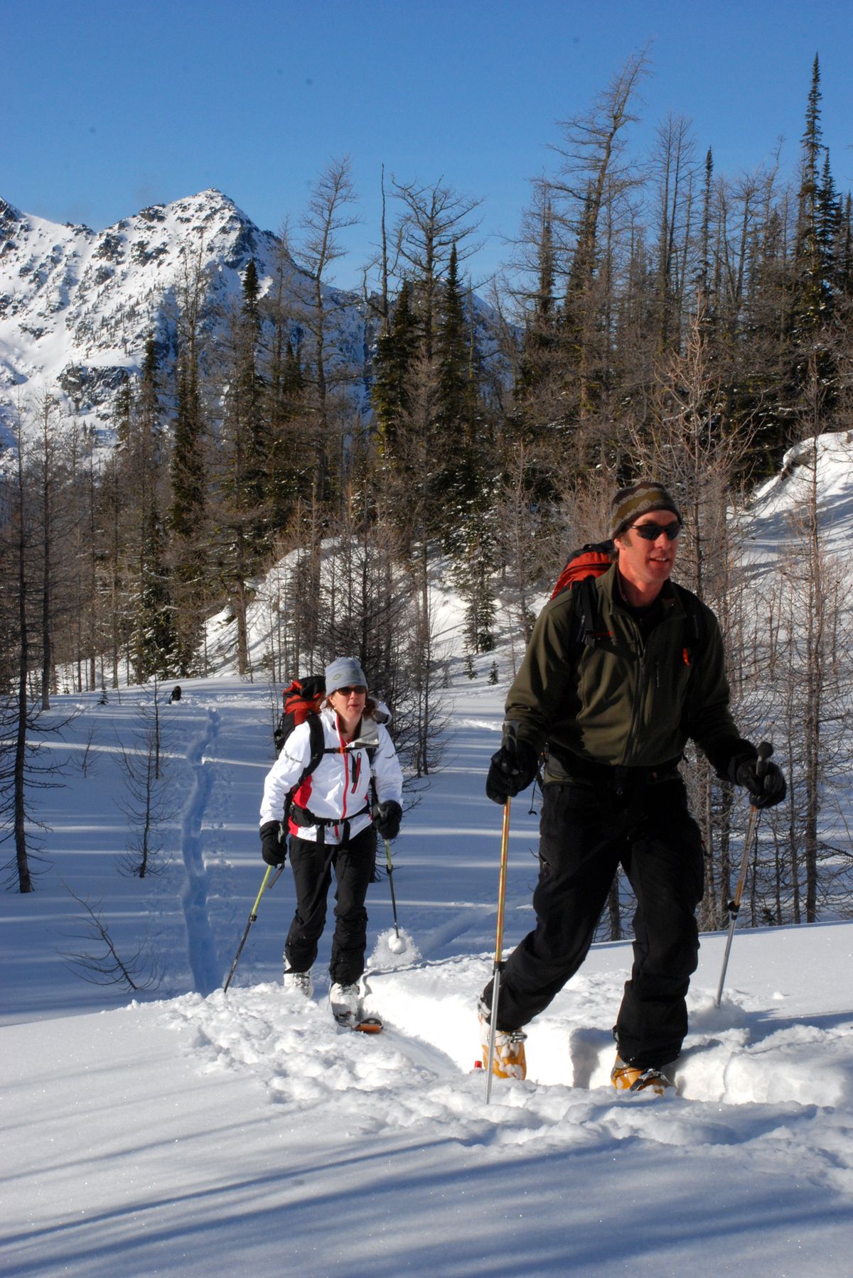 Sarah and Mark Yancey make a break high in the Purcell Mountains for one quick ski run before dinner.  (File)