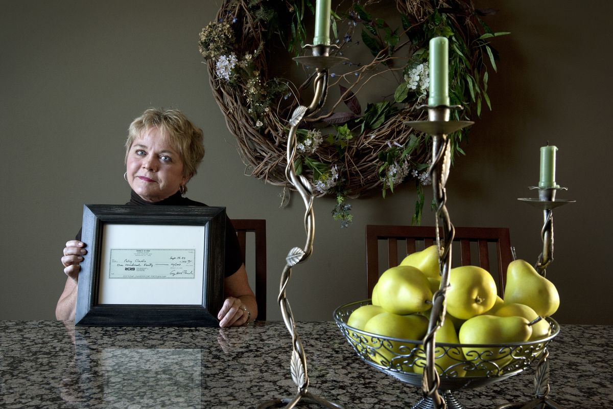 Rose Rhoades displays her copy of a check President George H.W. Bush wrote after having dinner with Speaker of the House Tom Foley at Pasty Clark’s restaurant in September 1989. Rhoades was their server for the evening, and Bush’s personal check totaled $140. (Dan Pelle)