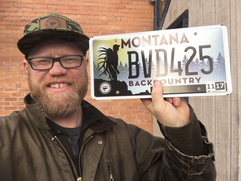 Land Tawney, president of Backcountry Hunters & Anglers holds a vehicle license plate authorized in Montana in 2015 to raise money for protecting backcountry hunting opportunities. (Courtesy)