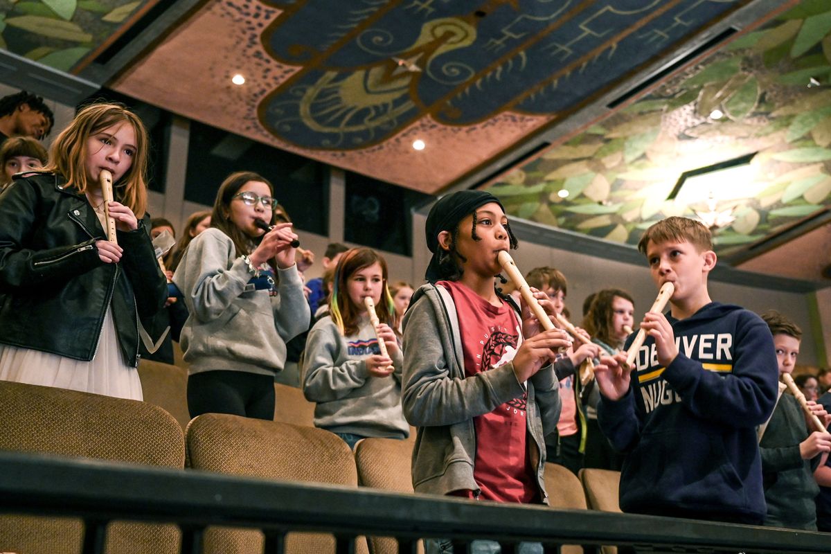 Indian Trail Elementary School students Liz Hastings, left, Josie Gneadinger, Lorelei Holland, Kaimen Beggs and Ollie Gurash play their recorders along with the Spokane Symphony during a Link Up program Wednesday at the Fox Theater.  (DAN PELLE/THE SPOKESMAN-REVIEW)