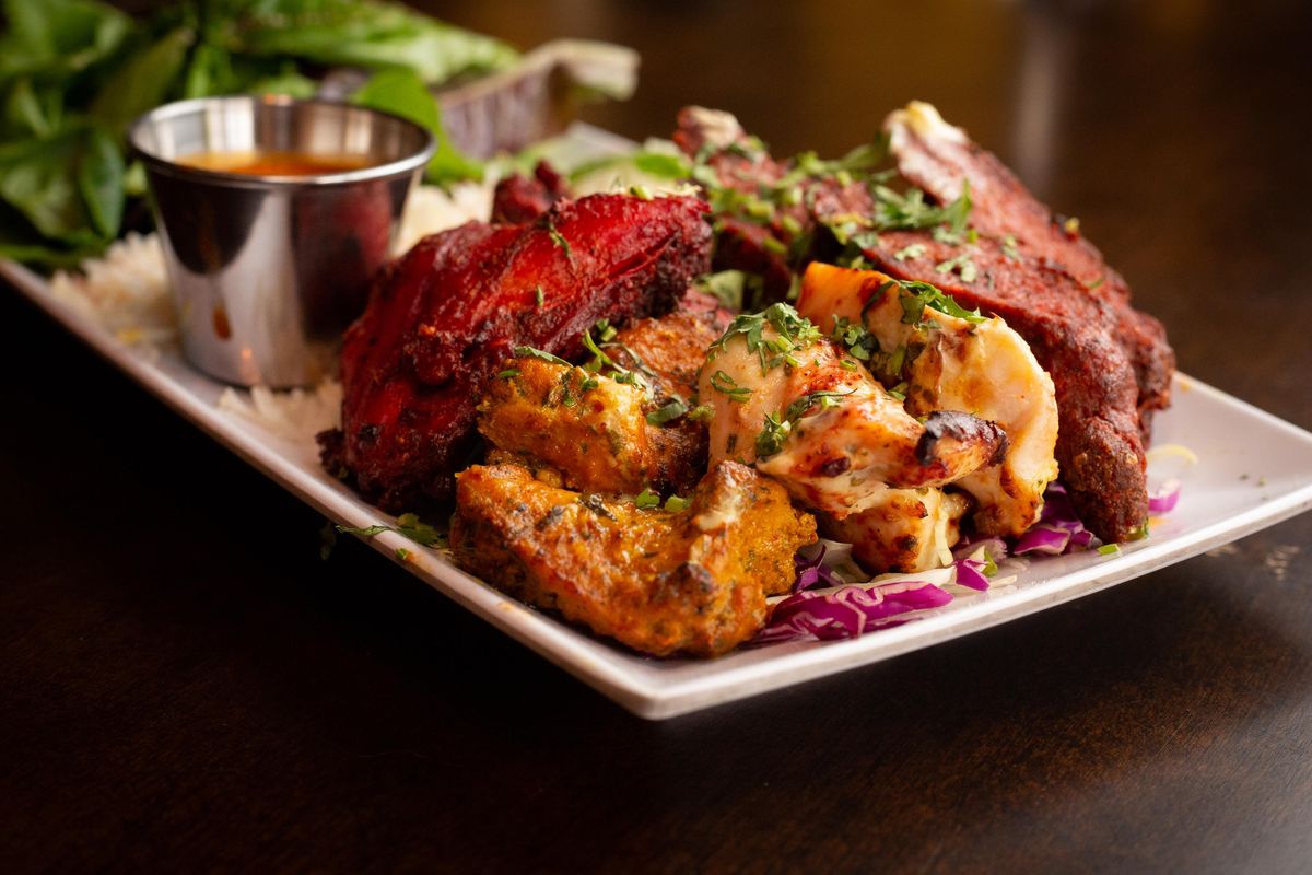 The mixed grill plate goes for $20 at The Mango Tree Indian Kitchen & Tap House and contains a combination of all available grill items, plus a house salad and rice on May 23, 2019 in Spokane, Wash. The Spokane location opened May 12 and is located at 401 W. Main Avenue. (Libby Kamrowski / The Spokesman-Review)