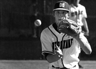 
Mt. Spokane shortstop Jarek Cunningham prepares to field a grounder during Tuesday's regional. 
 (Jed Conklin / The Spokesman-Review)