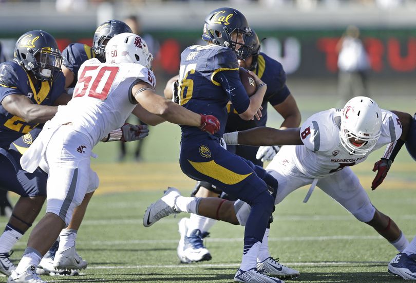 WSU’s Hercules Mata’afa (50) and Jeremiah Allison, right, pressure California quarterback Jared Goff during the second half. (Associated Press)